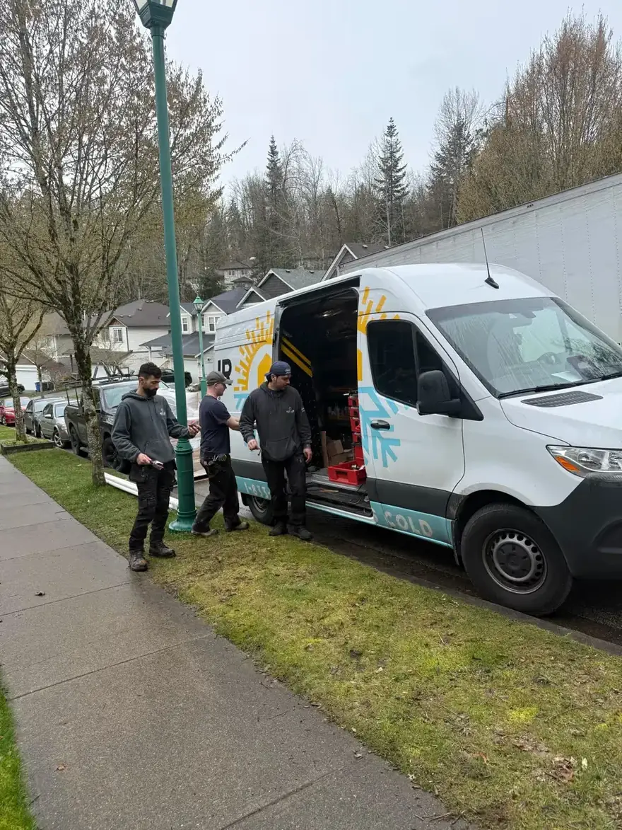 Rep-Air crew unloading a van on a residential street