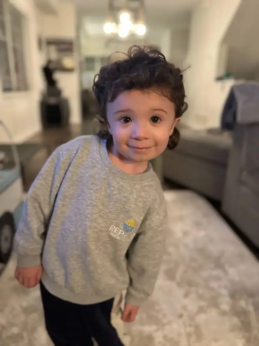 Child wearing a Rep-Air sweatshirt
