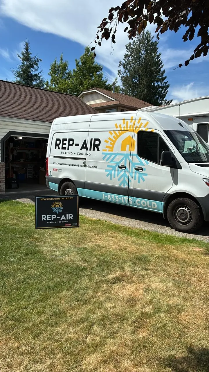 Rep-Air van and yard sign at a home