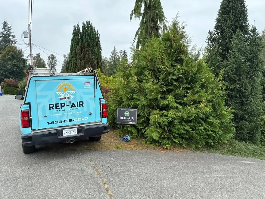 Rep-Air truck and yard sign at a home