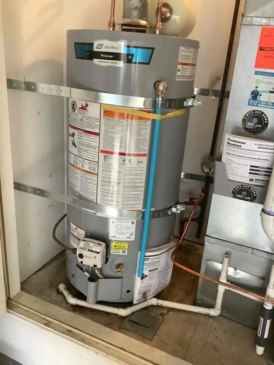 Gas tank water heater with seismic straps in a closet