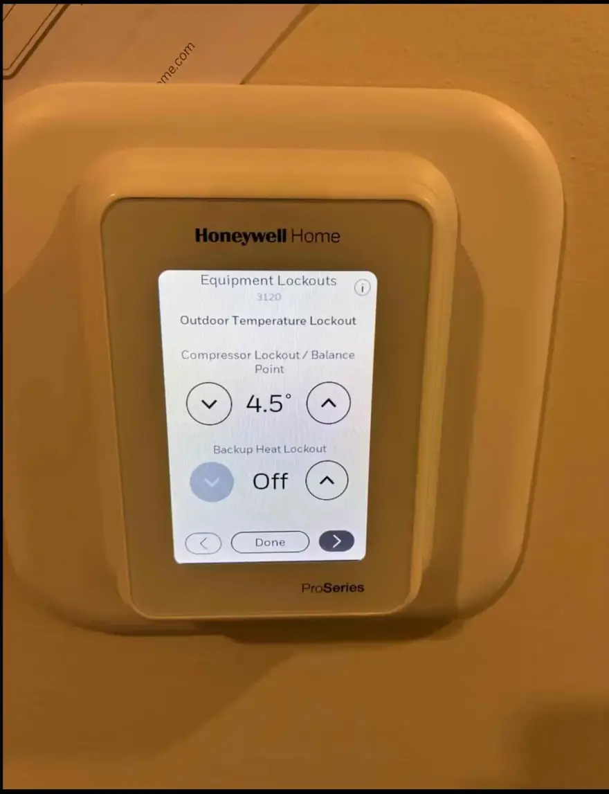 Honeywell Home thermostat showing heat pump lockout settings