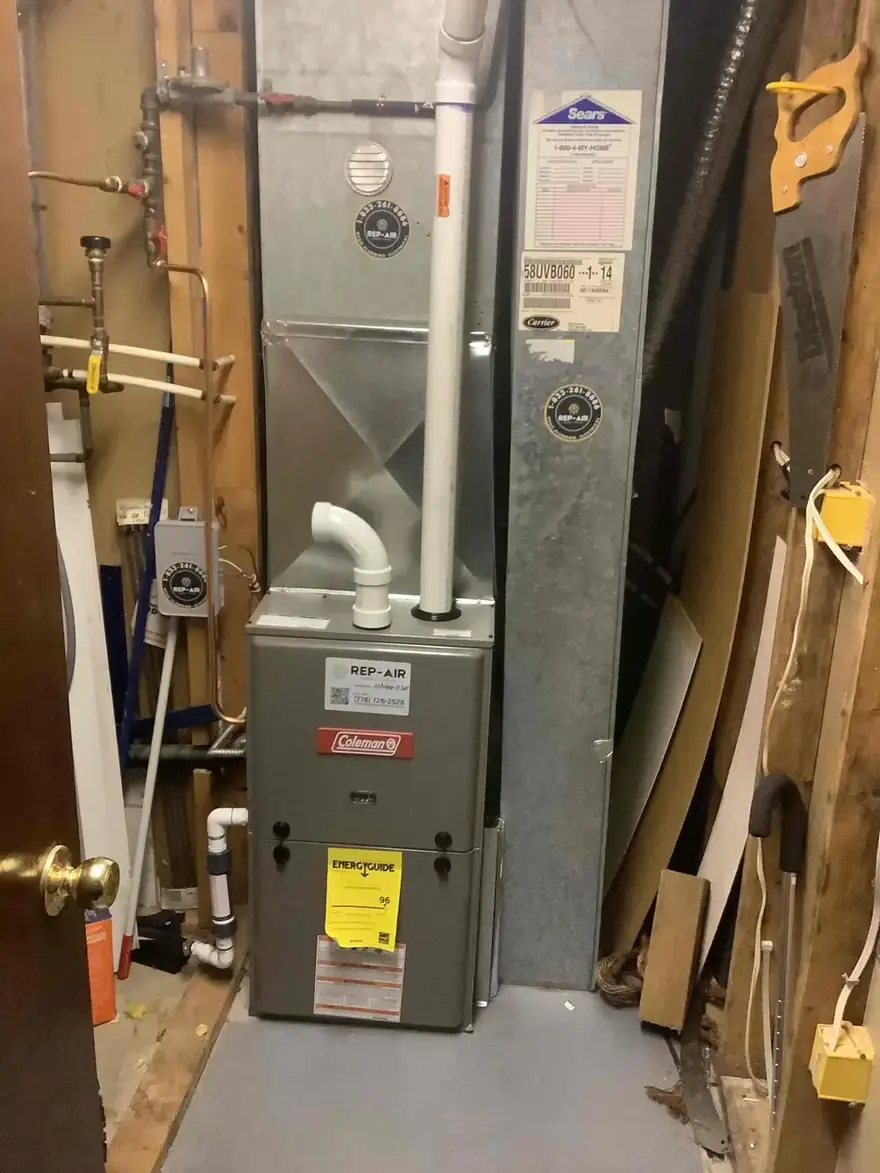 Coleman gas furnace installed in an unfinished basement