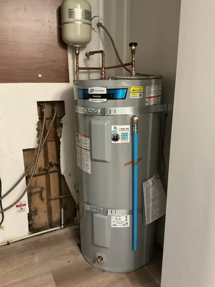 Electric tank water heater with an expansion tank