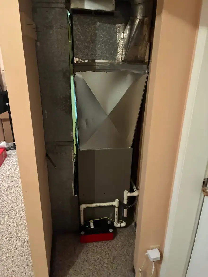 Air handler and condensate pump installed in a narrow closet