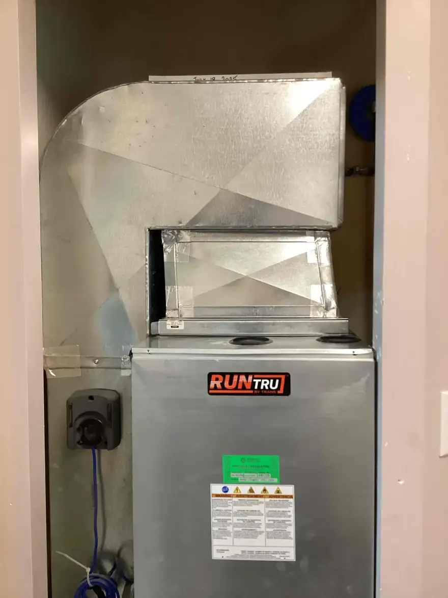 Air handler with a new supply plenum in a closet