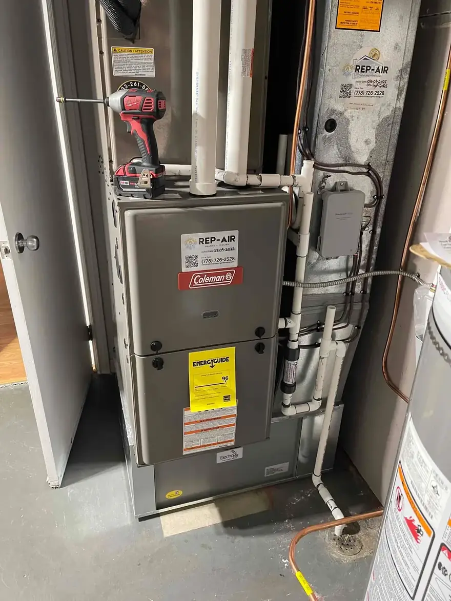 Coleman gas furnace with a Rep-Air sticker during an install