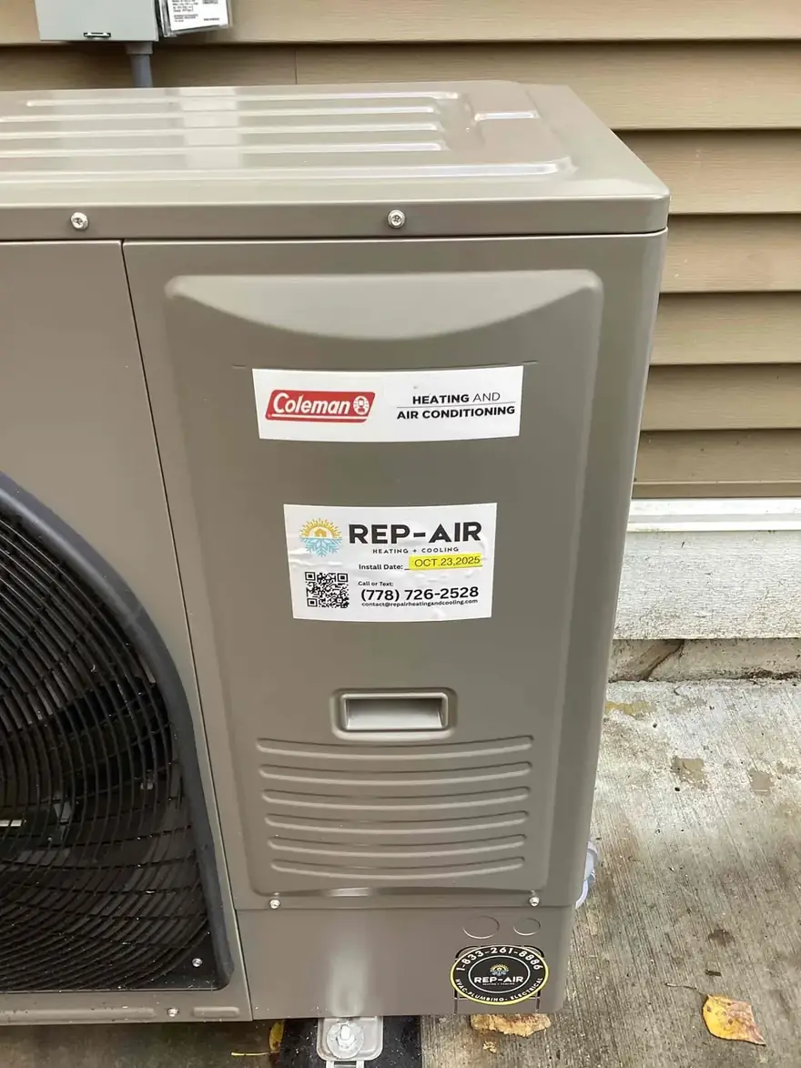 Coleman heat pump outdoor unit with a Rep-Air service sticker