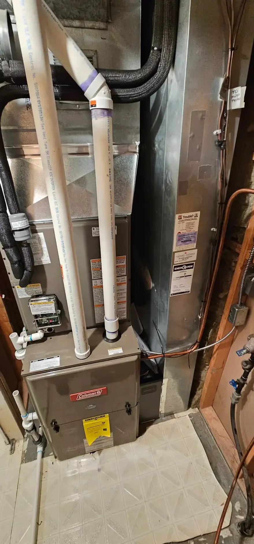Gas furnace with new venting in a narrow basement closet