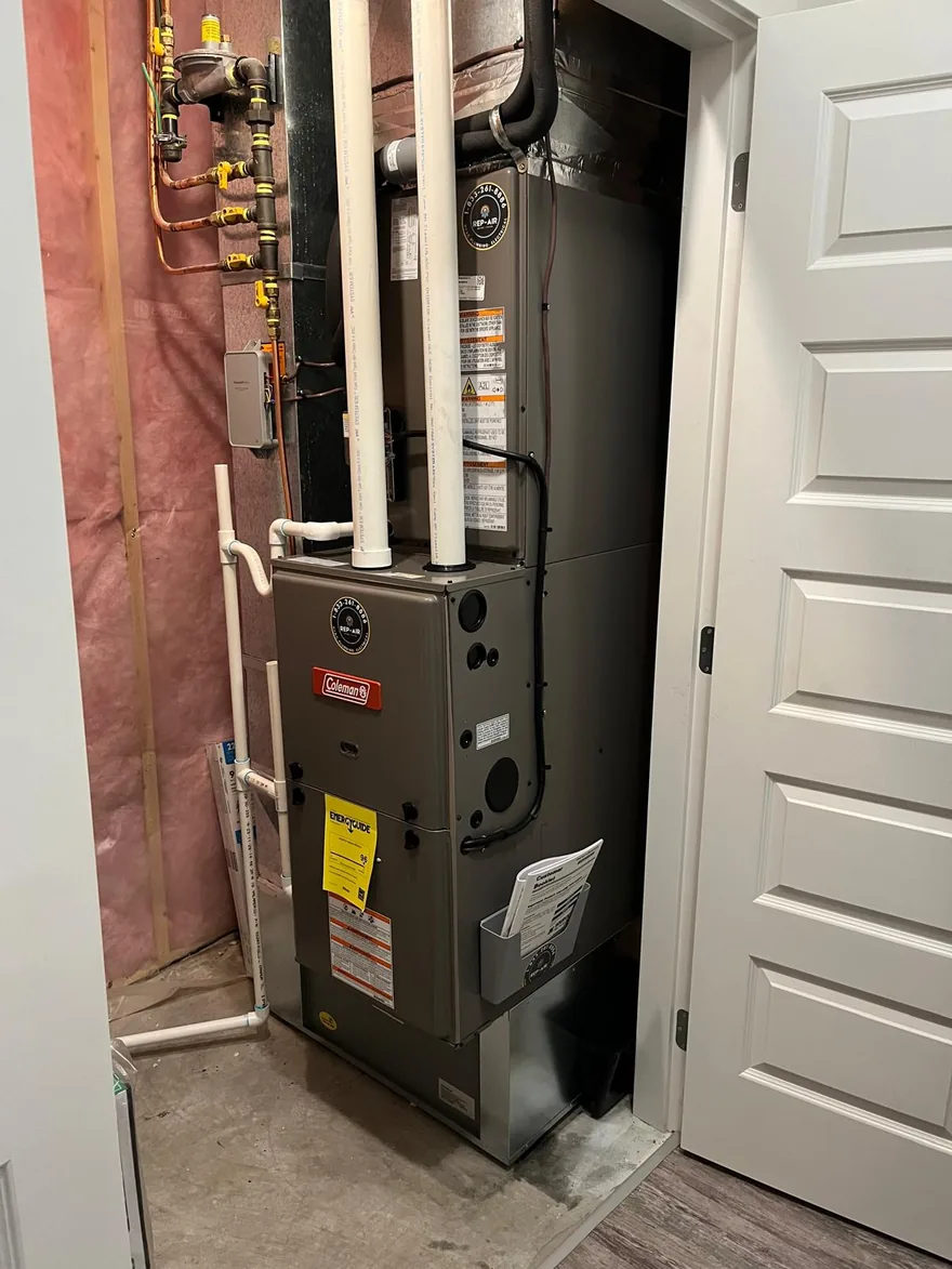 Coleman gas furnace with new venting in a basement closet